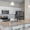 kitchen with a large counter and bar stools