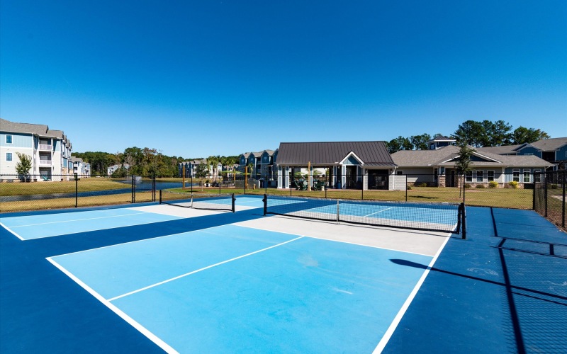 A pickleball court with fence.