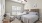 a bedroom with a bed and a fan