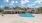 a swimming pool in front of a house