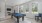 a room with a pool table and chairs