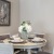 a dining table with plates and cups on it