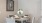 a dining table with plates and cups on it