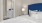 a bed with a blue headboard