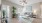 a living room with a rug and a fan