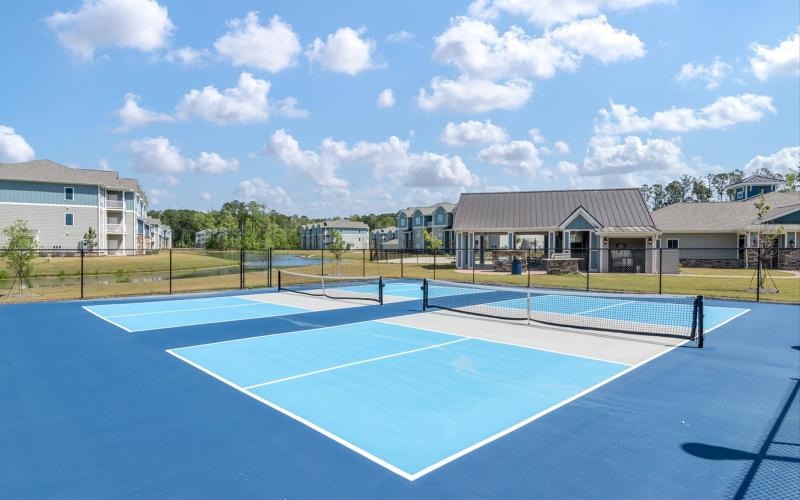 a tennis court with a fence